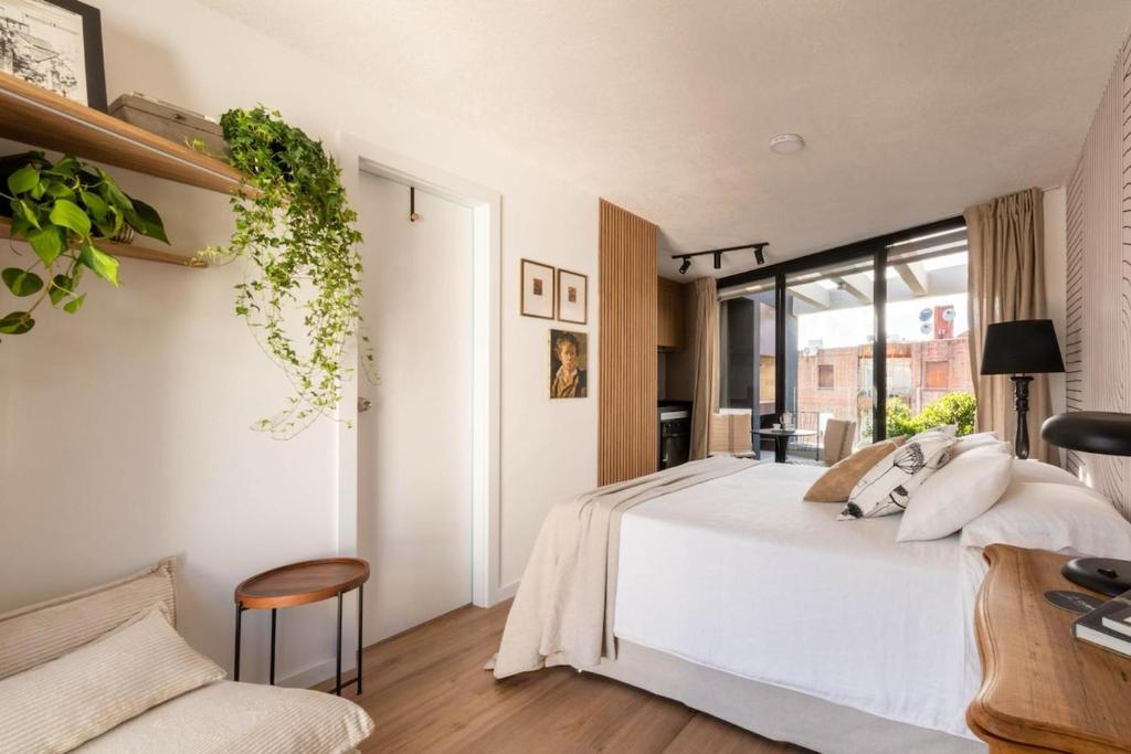 Ένα ή περισσότερα κρεβάτια σε δωμάτιο στο Monoambiente chic en Cordón Sur