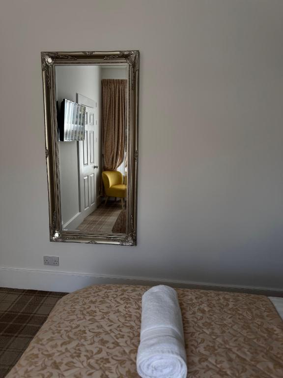 Postel nebo postele na pokoji v ubytování Sandvilla Guesthouse