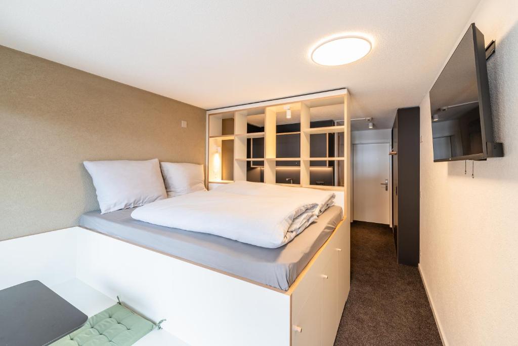 Postel nebo postele na pokoji v ubytování Homebase by Revier