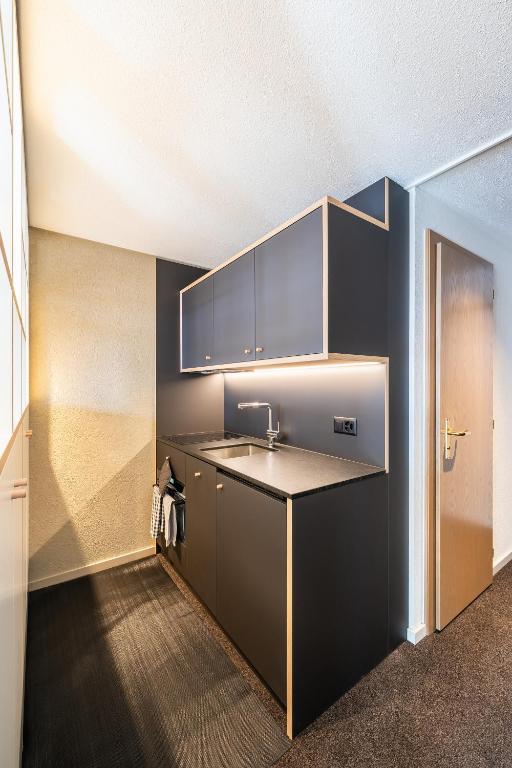 Kuchyň nebo kuchyňský kout v ubytování Homebase by Revier