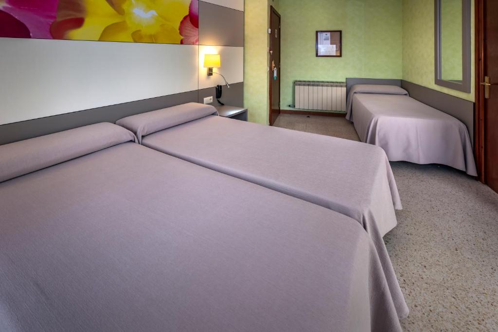 Postel nebo postele na pokoji v ubytování Hotel Sabiote