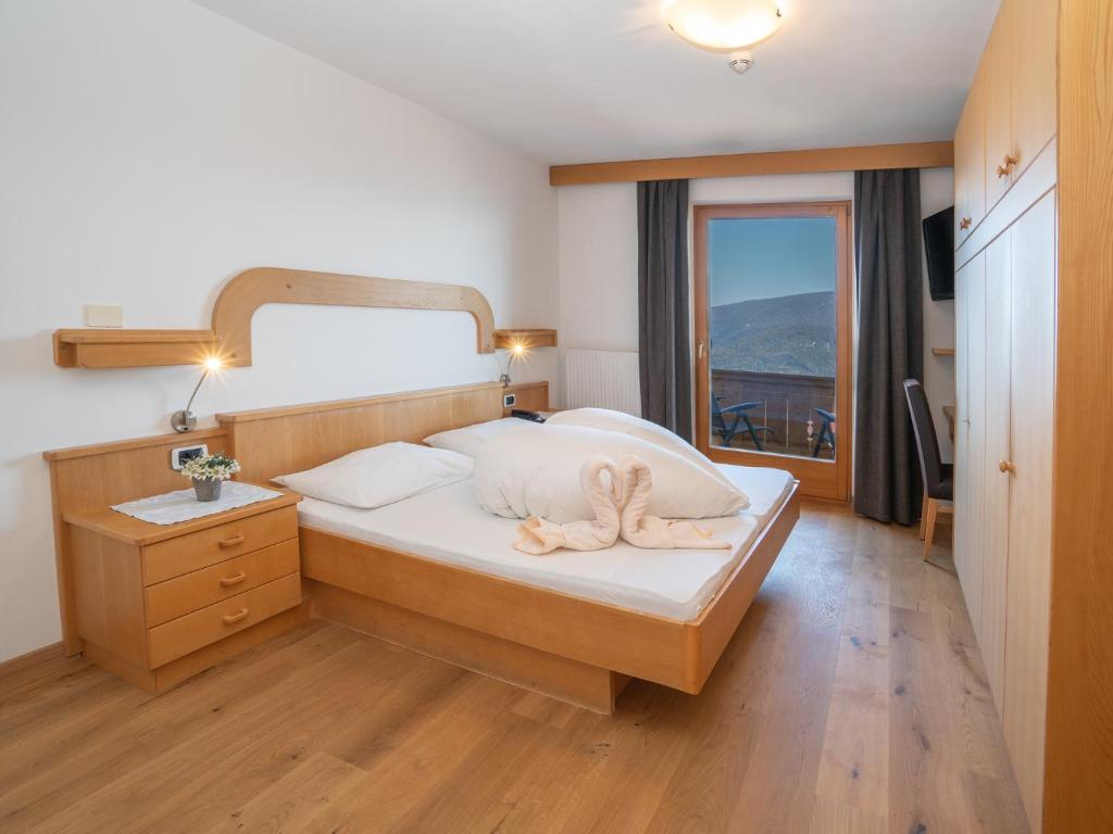 Postel nebo postele na pokoji v ubytování Hotel Purvita by Oberlechner