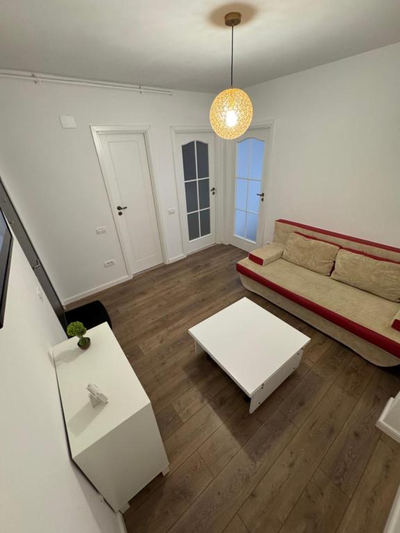 a living room with a couch and a table at Studio Luca in Eforie Nord