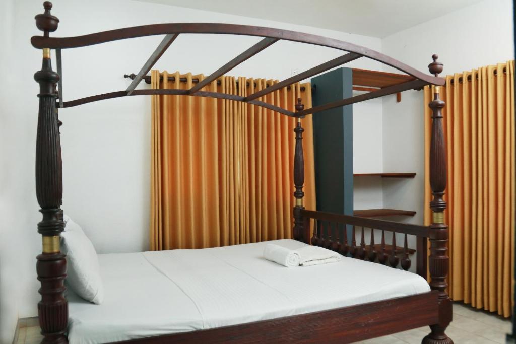 Postel nebo postele na pokoji v ubytování Rosanuka Beach Villa