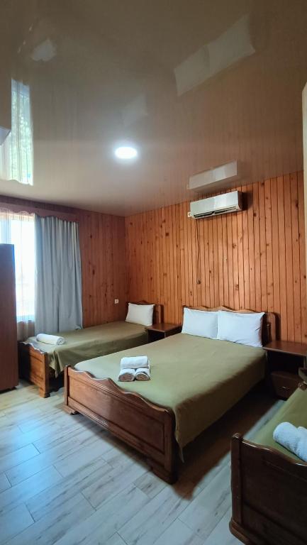 Postel nebo postele na pokoji v ubytování Villa Ureki