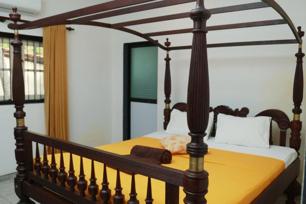 Postel nebo postele na pokoji v ubytování Rosanuka Beach Villa