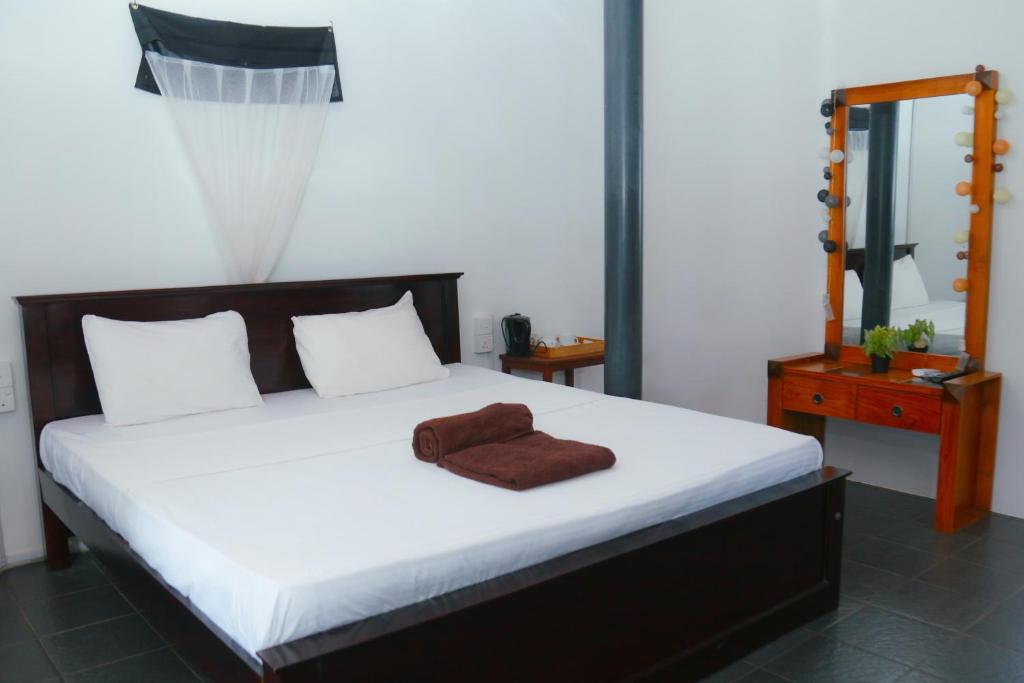 Postel nebo postele na pokoji v ubytování Rosanuka Beach Villa