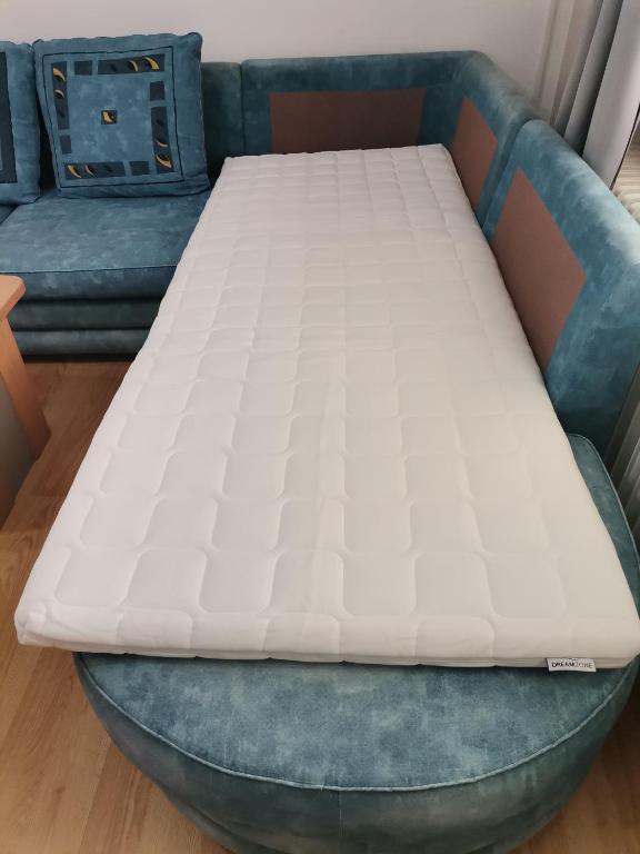 Voodi või voodid majutusasutuse Apartman Meridian toas
