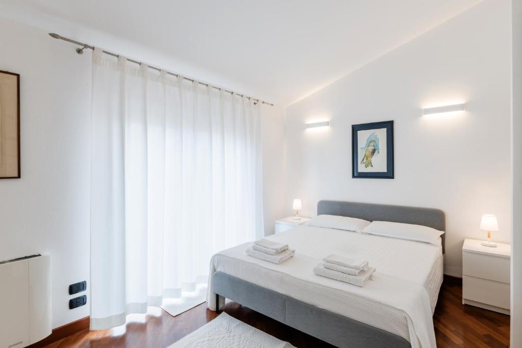 A bed or beds in a room at Appartamento MarySol