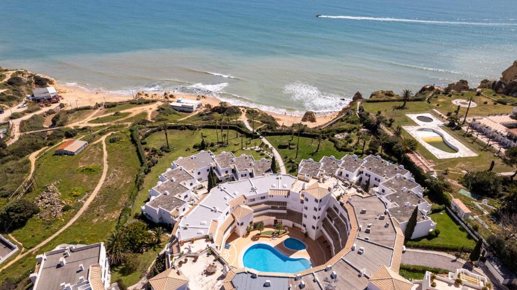 an aerial view of a building next to the ocean at Apartment Estrelícia Direct beach access in Porches