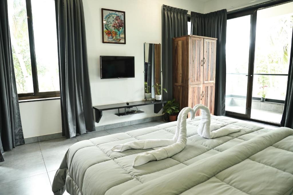 Vuode tai vuoteita majoituspaikassa Fusion Home