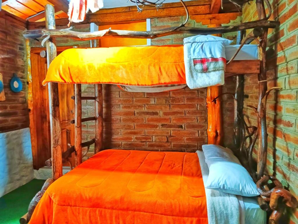 Postel nebo postele na pokoji v ubytování Hospedaje Vertientes del Imbabura