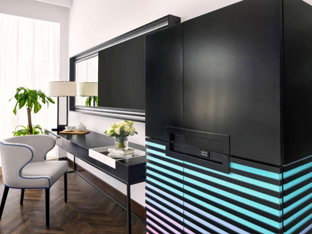 TV a/nebo společenská místnost v ubytování Pullman Dubai Downtown