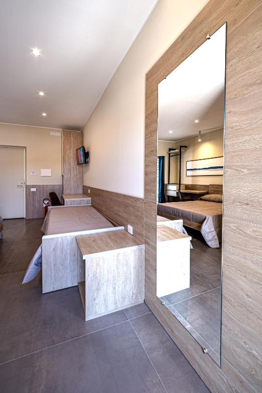 Postel nebo postele na pokoji v ubytování 4Rooms