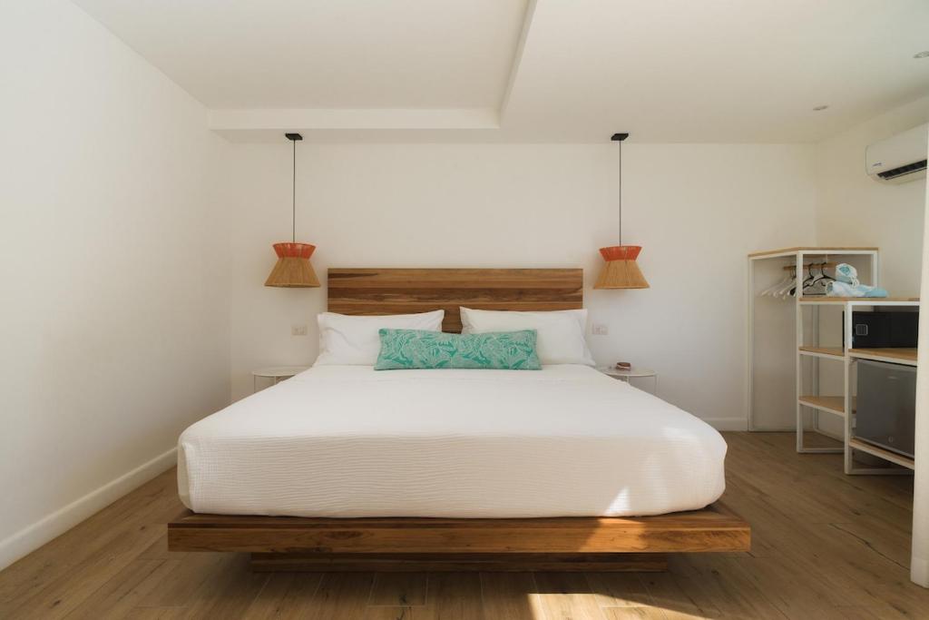Postel nebo postele na pokoji v ubytování BOHO Tamarindo