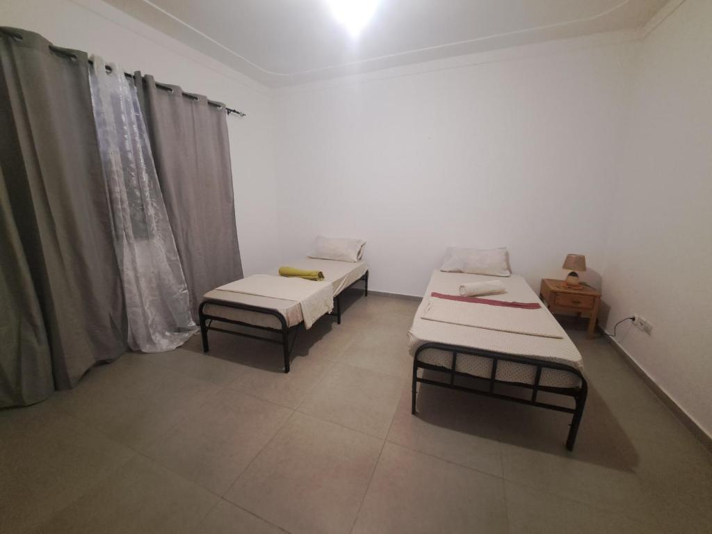 Postel nebo postele na pokoji v ubytování Barros Homestay