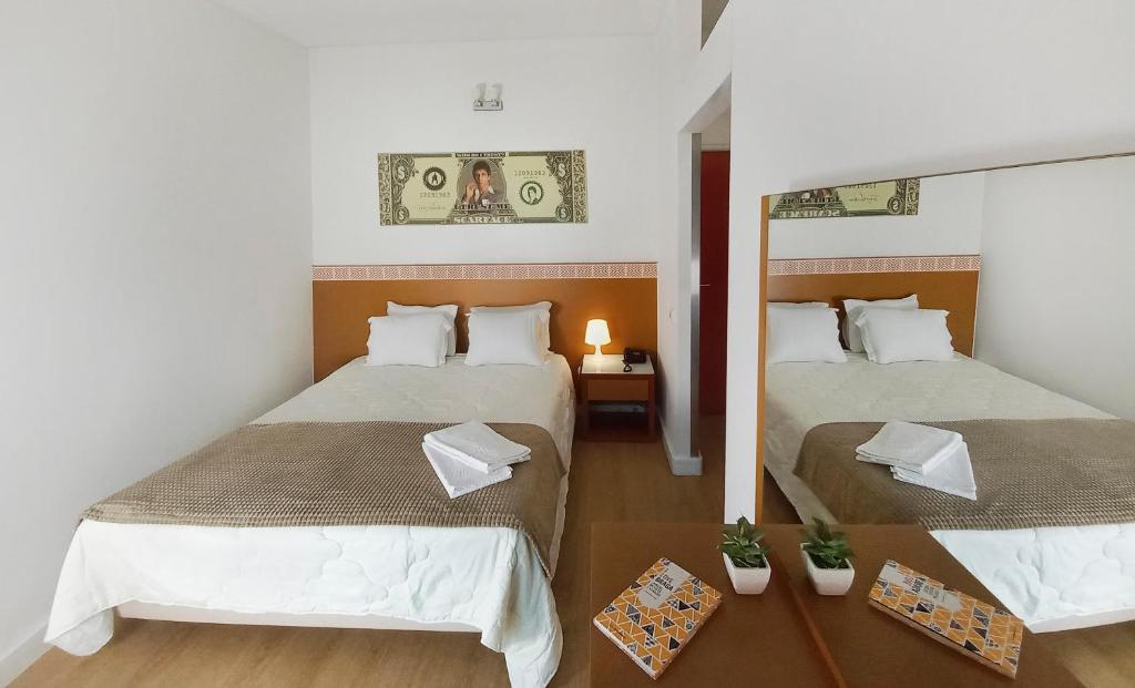 Postel nebo postele na pokoji v ubytování Hotel Joao XXI