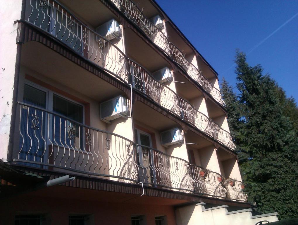 a building with balconies on the side of it at Penzion Premona in Nitra