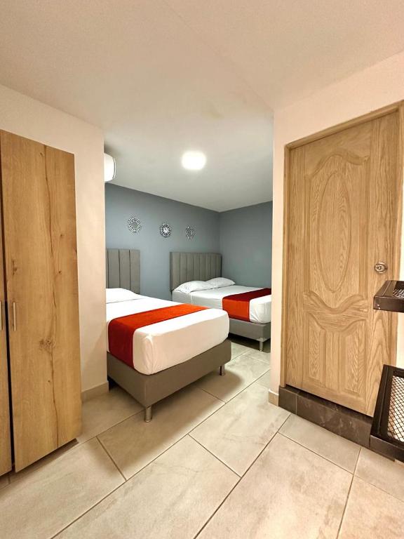 Postel nebo postele na pokoji v ubytování Hotel Nakama
