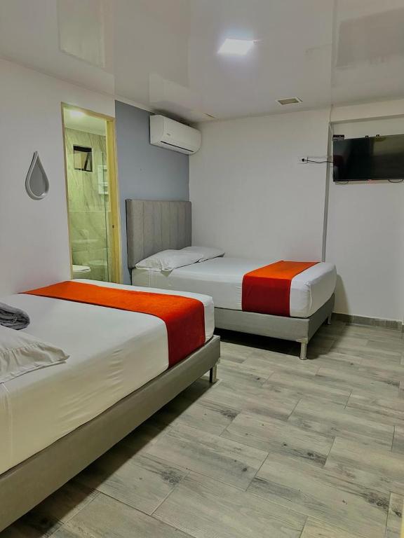 Postel nebo postele na pokoji v ubytování Hotel Nakama