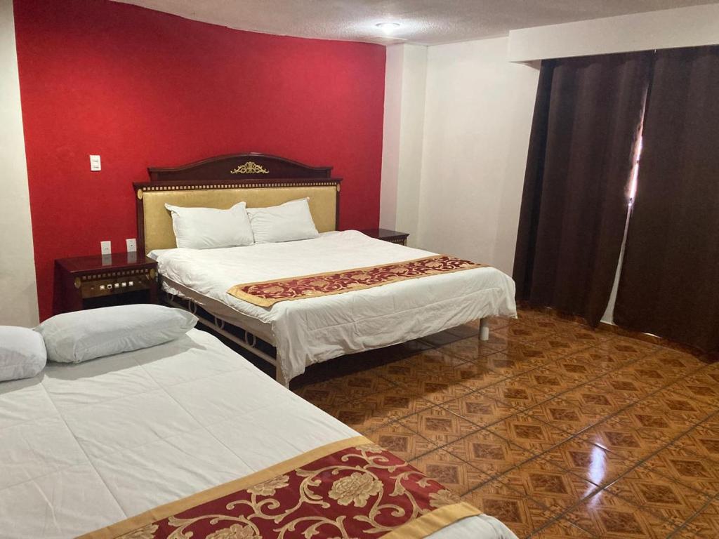 Postel nebo postele na pokoji v ubytování Hotel Mandarin