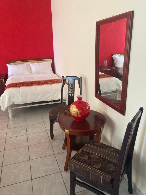 Postel nebo postele na pokoji v ubytování Hotel Mandarin