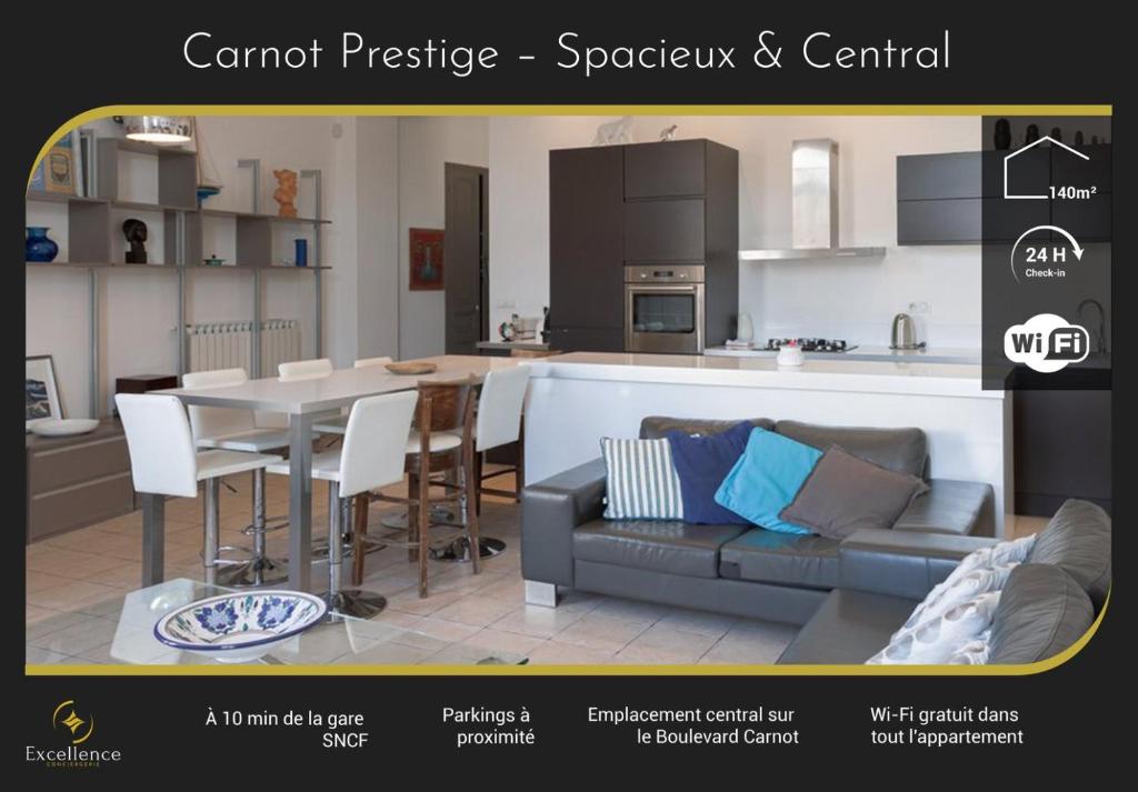 Il dispose d'une cuisine et d'un salon avec un canapé et une table. dans l'établissement Carnot Prestige – Spacious & Central, à Cannes