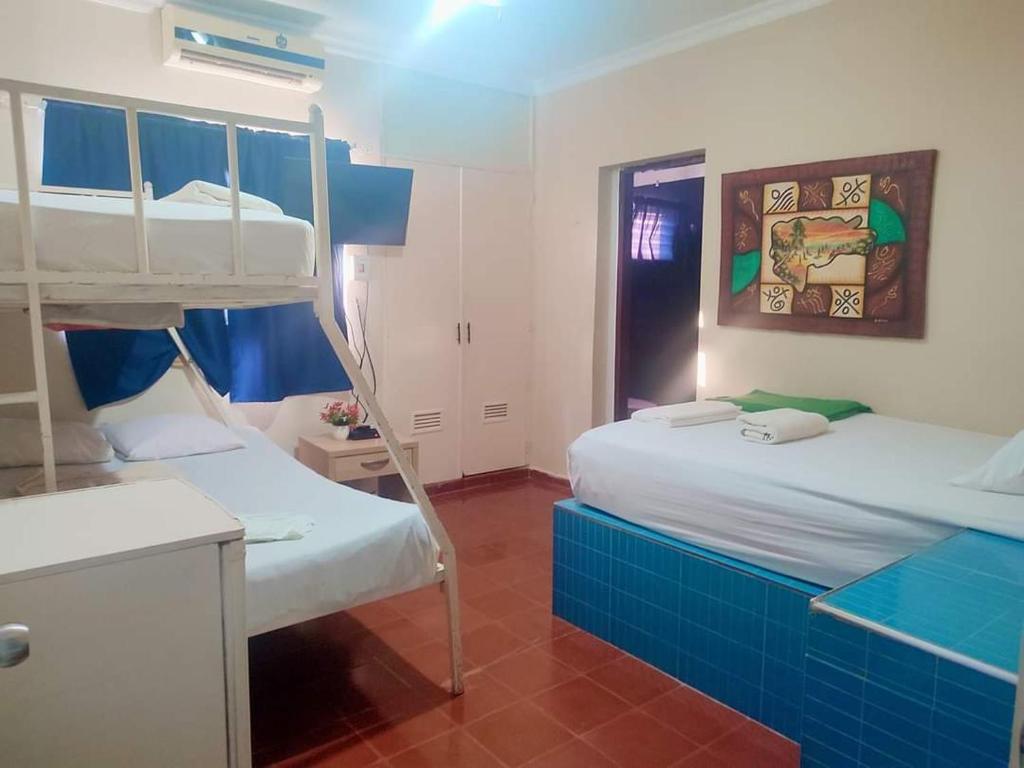 Postel nebo postele na pokoji v ubytování Hotel Kevin