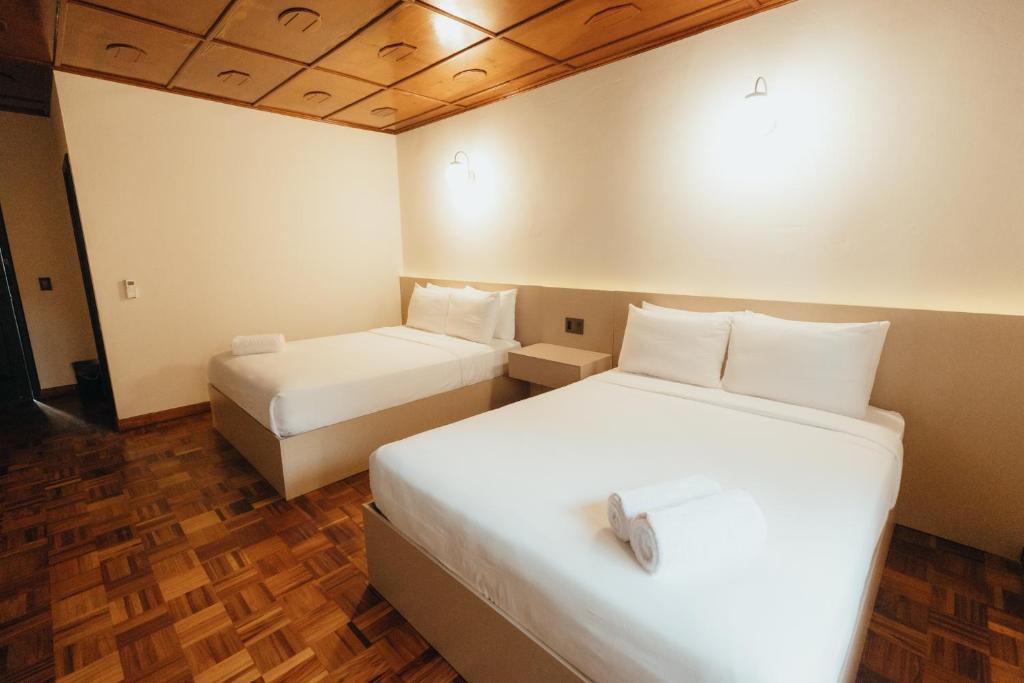 Postel nebo postele na pokoji v ubytování Hotel Boutique Rebequet