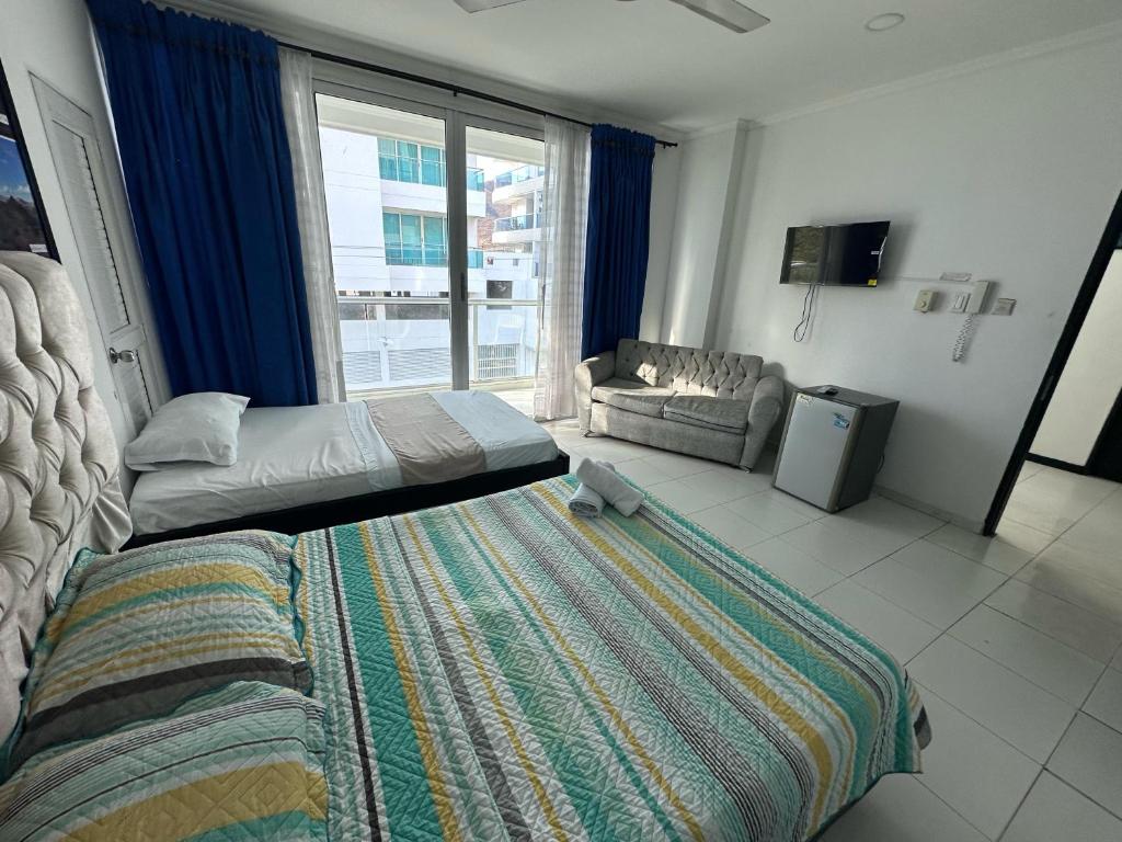 Postel nebo postele na pokoji v ubytování SGH Rodadero Suites