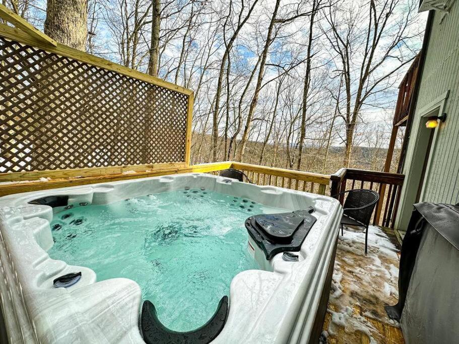 a jacuzzi tub on the back of a house at Hot Tub Sauna Steam Room in East Stroudsburg