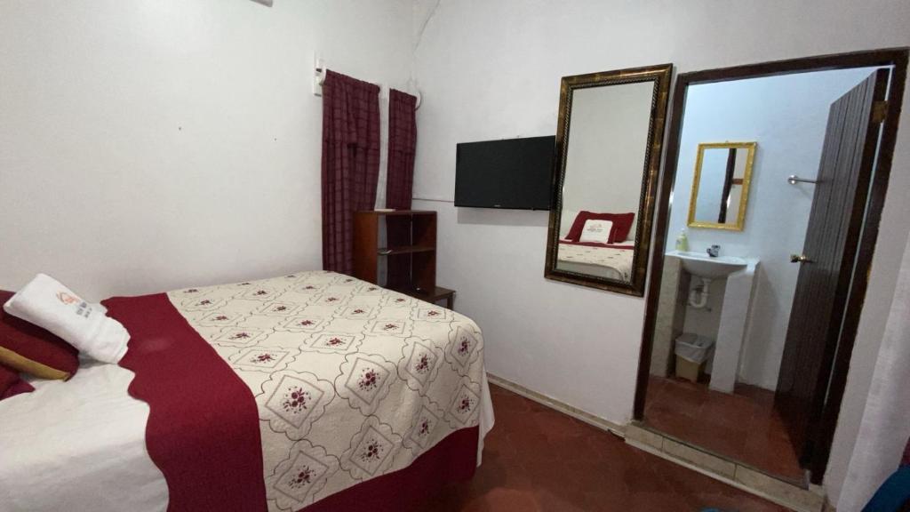 Postel nebo postele na pokoji v ubytování Hotel Marjenny