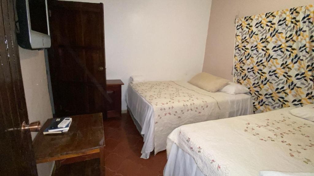 Postel nebo postele na pokoji v ubytování Hotel Marjenny