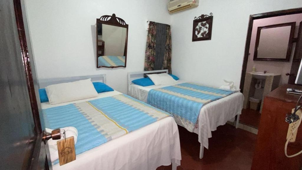 Postel nebo postele na pokoji v ubytování Hotel Marjenny