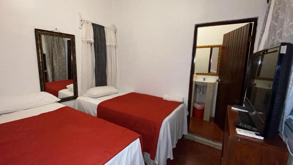 Postel nebo postele na pokoji v ubytování Hotel Marjenny