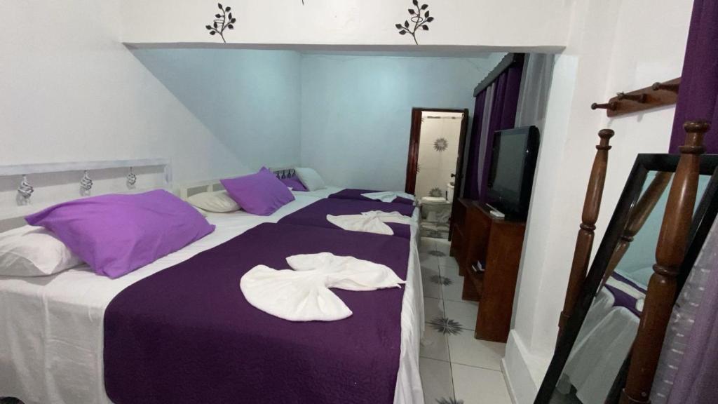 Postel nebo postele na pokoji v ubytování Hotel Marjenny