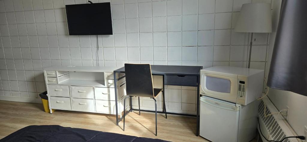 Kuchyň nebo kuchyňský kout v ubytování New Frontier Hotel