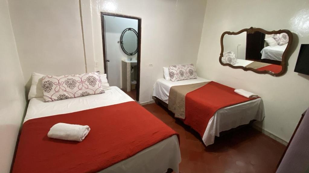 Postel nebo postele na pokoji v ubytování Hotel Marjenny