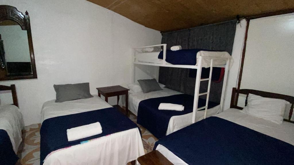 Postel nebo postele na pokoji v ubytování Hotel Marjenny