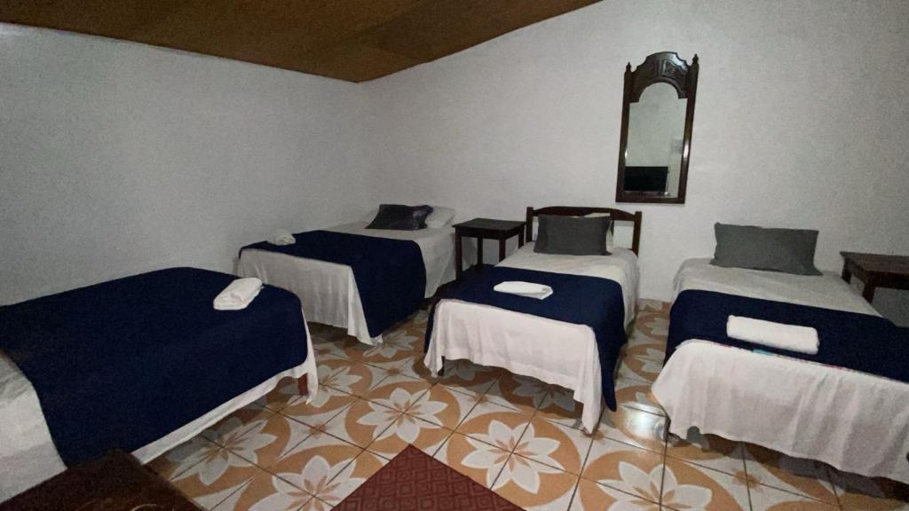 Postel nebo postele na pokoji v ubytování Hotel Marjenny