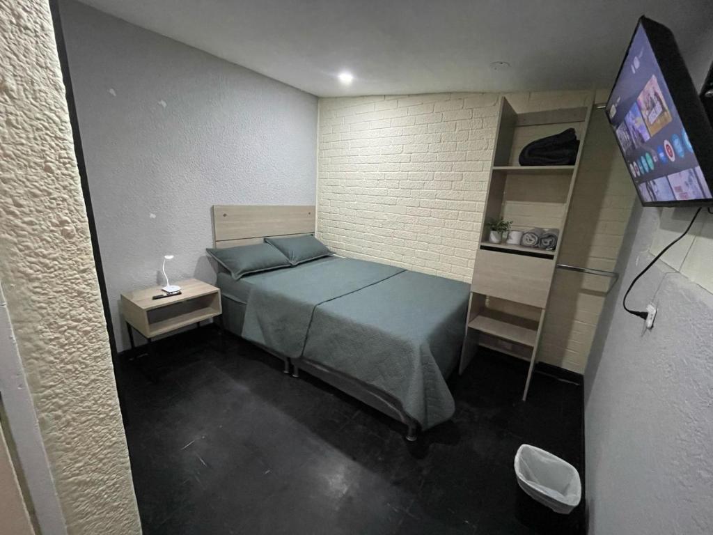 Postel nebo postele na pokoji v ubytování BogoRooms Av Suba 116
