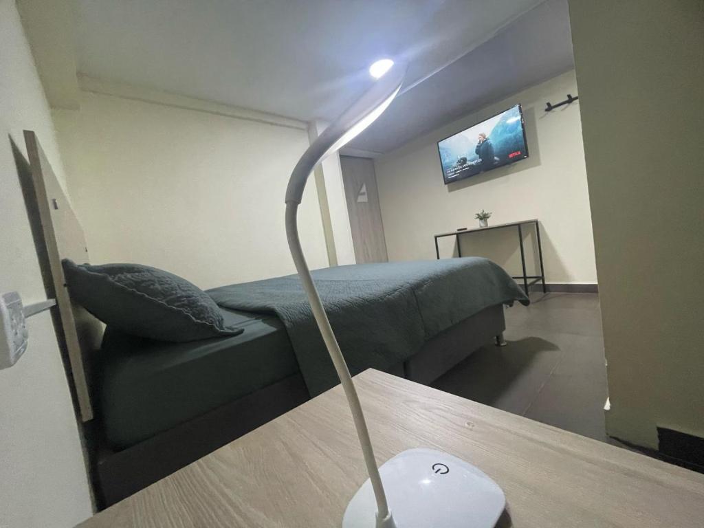 TV a/nebo společenská místnost v ubytování BogoRooms Av Suba 116