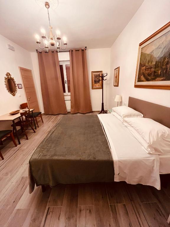 Postel nebo postele na pokoji v ubytování Pisa House