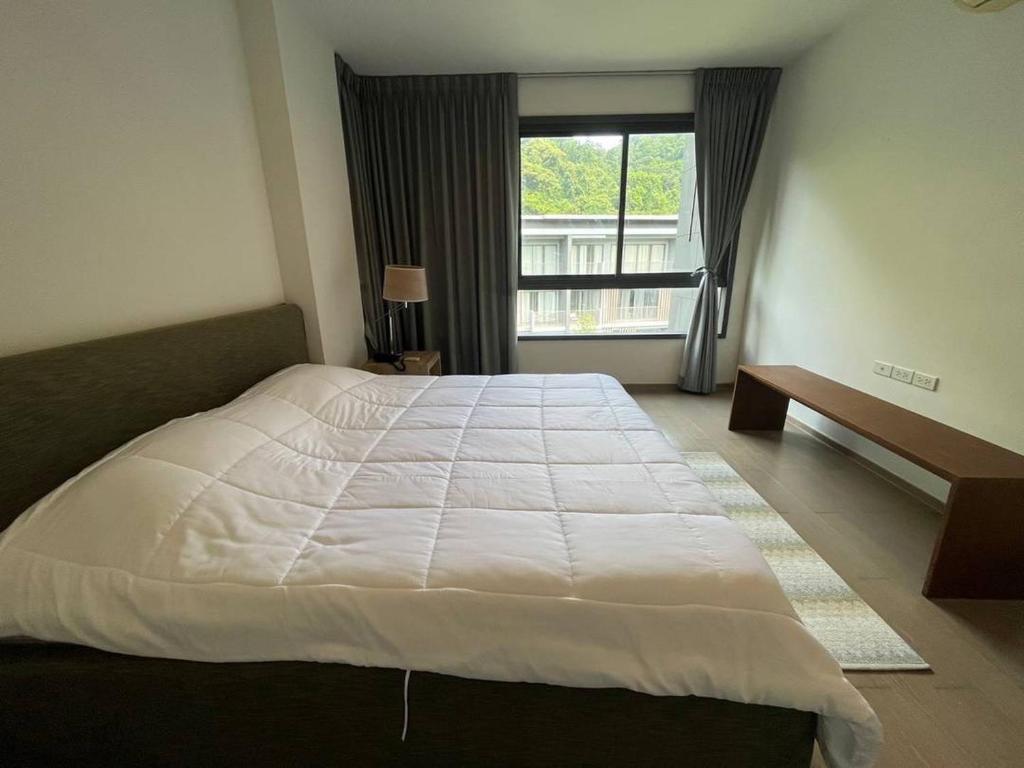 Postel nebo postele na pokoji v ubytování 23 Degree Khaoyai condo