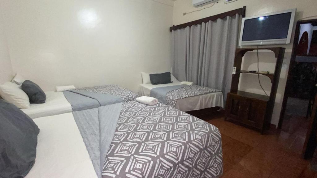 Postel nebo postele na pokoji v ubytování Hotel Marjenny