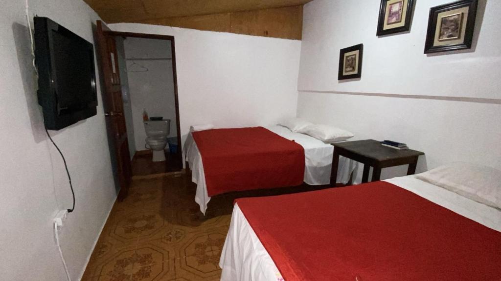 Postel nebo postele na pokoji v ubytování Hotel Marjenny
