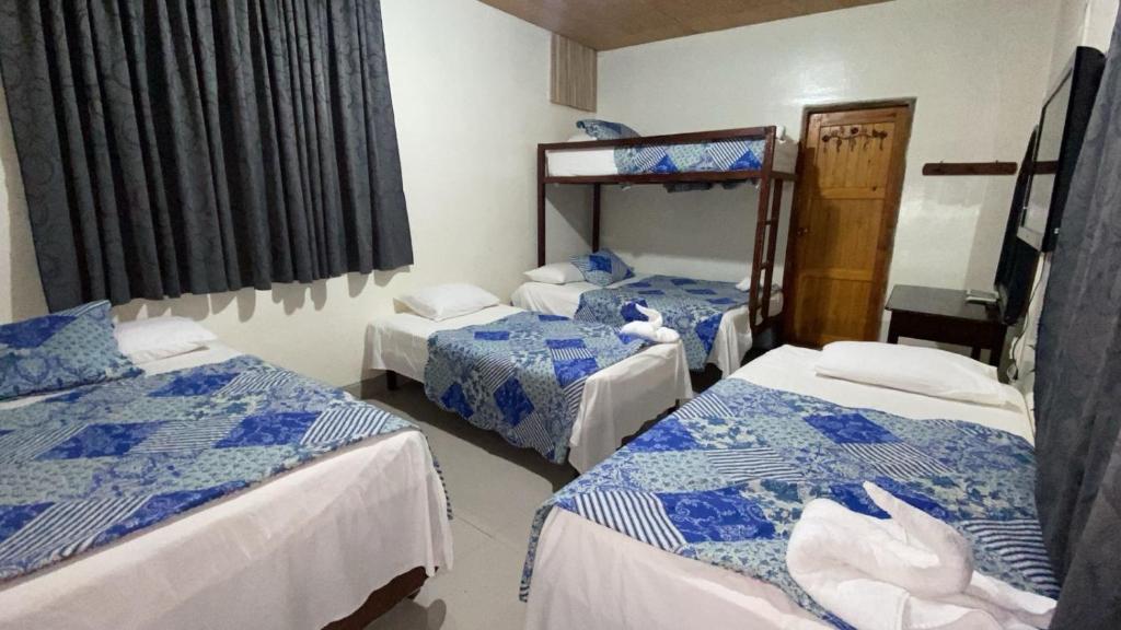 Postel nebo postele na pokoji v ubytování Hotel Marjenny