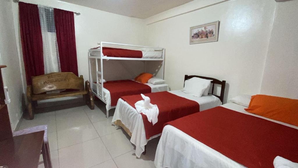 Postel nebo postele na pokoji v ubytování Hotel Marjenny