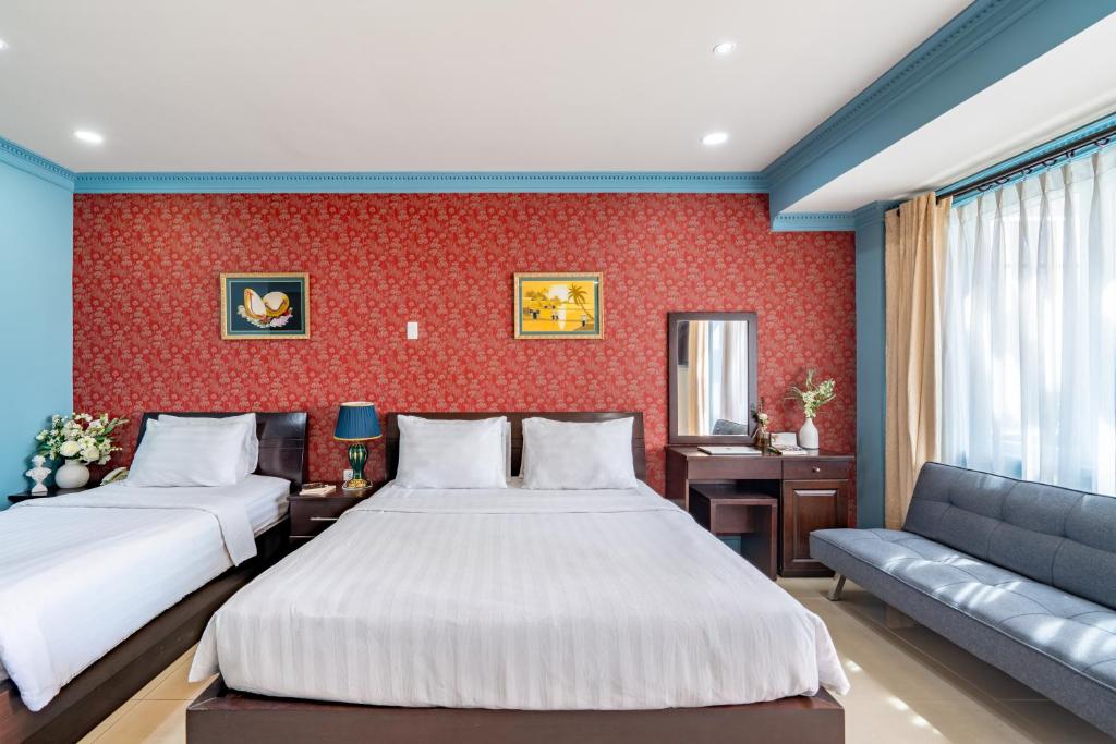 Giường trong phòng chung tại La Bonita Boutique Hotel