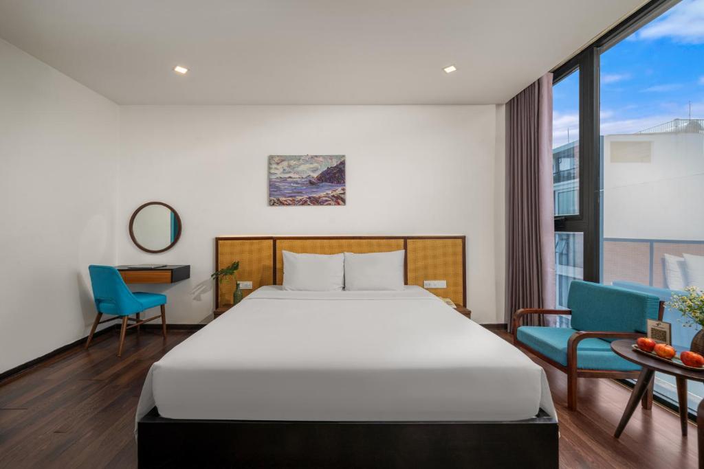 Postel nebo postele na pokoji v ubytování Platinum Danang Hotel